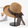 Szerokie czapki wiadra Rollowane Vintage Sun Hat Bowknot Crochet Sunshreen Słomka Składana czapka Fedora Women Outdoor Travel Beach Q240403