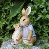 芸術と工芸品漫画の動物工芸装飾品シミュレーション動物彫刻ウサギはアーデン中庭の子どもの部屋の家の装飾を抱きますL2447