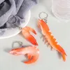 Portachiavi di portachiavi di gamberetti simulazione del piatto di pesce modella modella per bambini giocattoli per bambini con zaino per il ciondolo di gioielli divertenti