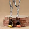 Keychains lanyards bokshandschoenen sleutelhanger antieke bronzen coole luxe metalen sleutelhanger auto sleutelhanger ringtas hanger voor sportbedrijf Gift Q240403