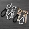 Keychains Lanyards Crystal leak proof luxury leather keychain womens mens car holder phone number label jewelry Q240403