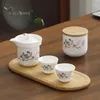 Zestawy herbaciarni Przenośna ceramiczna herbata z herbatą High-end Cup A Pot z czterech filiżanek i taca na świeżym powietrzu Gift Chinese Chinese
