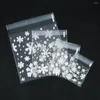 Sacs de rangement 100pcs / lot Transparent Snowflake OPP Sac-scellant Sac pour biscuit Candy Package Bijoux d'emballage Cadeau accessoires