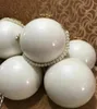 1pcs المرأة الفاخرة مخلب المحفظة العلامة التجارية الكتف BAG Girl Party Party Vip Gift Bag Black White Pearl Ball Handbag7402500