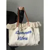 Women's 2023 New Letter Tassel Canvas Bag Women's Large Capacity Simplified One Shoulder Tote Bag 240408