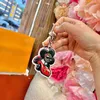 Sunflower Doll -keychain Classic Cartoon Key Chian Fashion Bag Associory Luxury Womens Mens زوجان Keyring CSD2404083