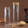 Боросиликатная стеклянная бутылка для бутылки с водой с двойной стеной с чайной бамбуковой крышкой