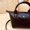 2024 Dames Nieuwe schattige prachtige lederen dumpling -tas Designer Solid Mini Ladies Crossbody Tas Winkelen Schoudertas Opruiming AZ