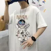 Astronaut tryckt kortärmad t-shirt för män, trendiga Instagram-par topp, sommar ny överdimensionerad lös halvärmad män