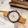 ساعات نسائية Shengke Simple Women Dress Es Retro Leather Clock Top Top Womens Fashion Mini Design Quartz Clock L46