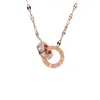 Trendy Titanium Steel Necklace with Dual Diamond-Embedded Rings Chic, Non-fading Pendant for a Sophisticated Look