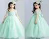 Adorável 2017 Mint Green Organza Princesa Flor Girls Dresses para casamentos espaguete de manga curta Limpe