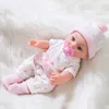 Realistische Babypuppe mit weichem Körper und Vinyl -Kopfarmen und Beinen, schöne weiche Babypuppe schöne Kleidung