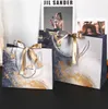 4 styles Sac-cadeau créatif Sac-cadeau d'emballage de bonbons pour le sac à main de gâteau d'anniversaire invité avec décor de fête en ruban