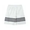 Versión correcta de pantalones de playa Sports Sports Shorts para hombres Parejas de verano Capris Pure Flowing Middle Descanado