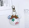 14style Designer keychain keychain mens mens keyring الذهب المطلي بوكيل الحبل خطاب مفتاح سلسلة النساء رجال portachiavi سحر السيارة الجلود مصمم المفاتيح الكلاسيكية مصمم