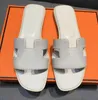 Designer tofflor kvinnor glider sandaler äkta läder sommar mode strand drag brun svart kvinnors sandal med dammväska 35-42