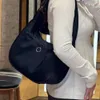 Sac à main de créateur de mode de couleur unie en nylon Sac à épaule applique étanche Femmes de luxe Sacs de selle de petite capacité sac fourre-tout