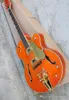 Orange semihollow electric guitar with gold pickup rosewood scale vibrato system customized service9456701