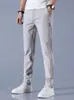 Hosen Männer Sommer Eis Silk Casual Hosen Männer gerade losen elastischen dünnen Stil schnelle trockene Jugendsportsporthose 240402