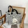 女性の小さなキャンバスハンドバッグかわいい有名な絵画布トートテイト女性デザイナーショッピングバッグ厚い綿の生地財布240328