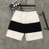 La versione corretta della lettera unisex in stile parigino stampato pantaloni da spiaggia per la spiaggia Famiglia a cinque punti Trendy