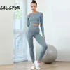 Salspor Women Fitness Yoga Suit Sport Gym Lange Mouw Hip Pants Training 2 PCS Set kleding vrouwelijk ensemble sport fietsen slijtage240325