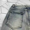 Jeans da uomo jeans slim jeans in angoscia in denim designer pantaloni in pelle con buchi lettere strappate al ginocchio strappato strappato per l'uomo dimensione della gamba dritta magra 29-38 lunga 2024cute