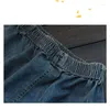 Kvinnors jeans 2024 Spring Summer Pending Minimalist Elastic High midja Solid Color Spliced ​​Pocket Loose A-Line Short Five