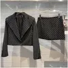 Vestidos de trabajo 2023 Sets de falda corta de otoño Set 2 piezas Girl Girl Stripes verticales Traje de diezumo chaqueta Blazer