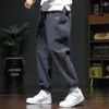 Jeans masculin coréen à la mode à la mode Street lâche Harlan Men massive de taille élastique Solide Patchwork Poches pantalon décontracté droit