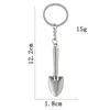 Keychains Novely Mini Shovel Keychain Simulation Metal Spade Keyring Car Keys Ryggsäck Gardening Pendant Decoration Tool Souvenir Present