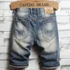 Мужские шорты 2024 джинсовая ткань для мужчин Лето персонализированный разоренный нищий свободный для модных уличных штанов с прямыми ногами