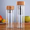 New Unique High-end Double Wall Insulated Tea Fruit Long Infuser Glass Water Bottle with Bamboo Lid