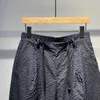 Męskie szorty Summer Szybkie suszenie cienkie spodenki do męskiej retro plisowane design swobodne spodenki spersonalizowane modne spodnie miasto J240409