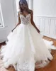 Sexy Open Back Lace Tulle Wedding Dresses A Line Spaghetti Straps Appliques Beads Ruffles Long Tran Bridal Gowns BC3162