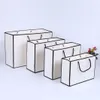 Sacchetto di carta kraft bianco kraft addensare vestiti regalo confezione da confezionamento sacchetto di carta regalo con manici1942427