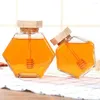 Bouteilles de rangement à la maison en liège hexagone transparente avec un distributeur de pot de pot de miel en bois en bois