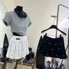 デザイナースカートの女性スカートファッションサマーレター刺繍ショートドレスヘビーラインストーンカジュアルプリーツスカート
