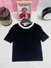 Spring and summer new knitted short sleeved classic round neck contrasting color design