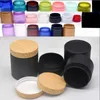 Pottes alimentaires Canisters 10/30 / 50pcs100-250 Boîte en plastique noir mat avec couvercles de pluie en bois Pot de masque vide Conteneurs de maquillage de maquillage Boîte de voyage L49