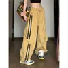 Amerikaanse stijl gepersonaliseerde straat breedbeenbroek Haruku Pocket Geel gestreepte casual broek Hoge taille los passende werkkledingbroeken voor vrouwen