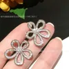 Новые высококачественные дизайнерские серьги цветочных серьги с изысканным алмазом.