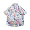 Mäns avslappnade skjortor 2024 Summer Floral Blus Short Sleeved Loose Korean skjorta för pojkar och pojkar rufsade och stiliga topp Hawaii -semesterskjorta 2449