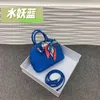 Bolide Leder Handtasche vertrauenswürdige Luxus Frauenbeutel 2024 Neue Top -Layer -Litchi -Muster Mini kleine Taschenschalenbeutel Süßigkeiten Farbe halbe Schulter haben Logo HBYIYF