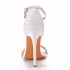 Chaussures habillées Crystal Queen Femmes Gladiateur sandales sexy White String perle High Heels Summer Party Buckles Pumps H240409 Jaui