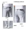 Mäns jeans designer Hong Kong jeans för mäns vår/sommar ny ljusgrå smal passform high-end casual byxor män 0vfz