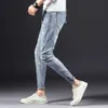 Designer Men's Jeans Yan Xuan Spring och Autumn New Korean Edition Mens Elastic Slim Fit Denim Pants Youth Fashion Perforated Feet Pants S1112