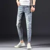 Designer Men's Jeans Yan Xuan Spring och Autumn New Korean Edition Mens Elastic Slim Fit Denim Pants Youth Fashion Perforated Feet Pants S1112