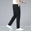 Pantalon masculin masculin zipper poche extension décontractée droite lâche mince respirant pantalon de sport printemps d'été élastique